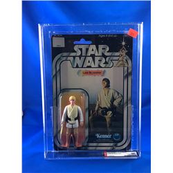 1977 KENNER STAR WARS LUKE SKYWALKER FIGURE IN ORIGINAL PACKAGE 12 BACK B AFA GRADED 80 NM