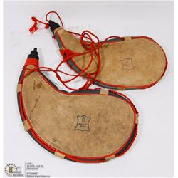 A PAIR OF VINTAGE LEATHER WATER JUGS