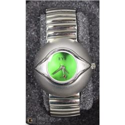 51) GREEN FACED "EYE" STAINLESS FASHION WATCH