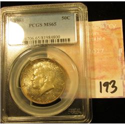 1964 P Kennedy Half Dollar. PCGS slabed MS 65. Obverse toned.