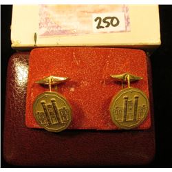 Pair of Gold-plated Cuff Links depicting the Royal Canadian Mint. In original box of issue.