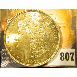 1921 P U.S. Morgan Silver Dollar, Superb Gem BU with golden toning.