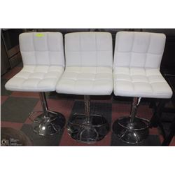 LOT OF 3 WHITE LEATHERETTE BAR CHAIRS.