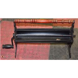 VINTAGE METAL PAPER LOG ROLLER