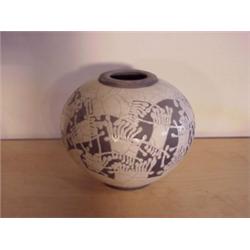 Young (20th Century), INDIAN MOTIF, a glazed ceramic vessel, 9 1/2" tall, signed. Provenance: D...