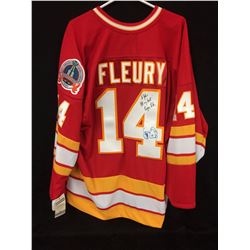 THEO FLEURY AUTOGRAPHED FLAMES JERSEY W/ INSCRIPTIONS