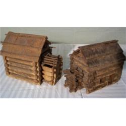 Two tramp art log cabins
