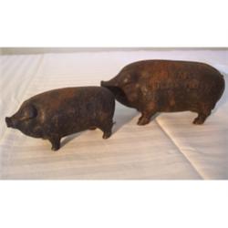 Two cast iron pig banks