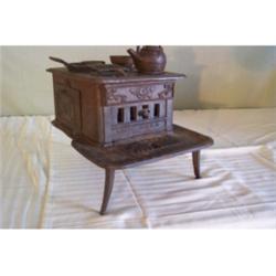 Cast iron stove - three legged, marked