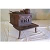Image 1 : Cast iron stove - three legged, marked