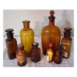 Eight assorted amber glass bottles