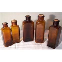 Five amber apothecary jars