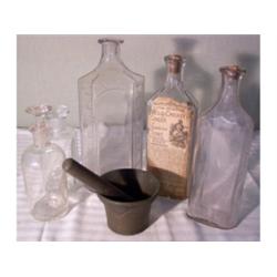Medicine bottles, mortar and pestle