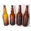 Image 1 : Four amber beer bottles from midwest