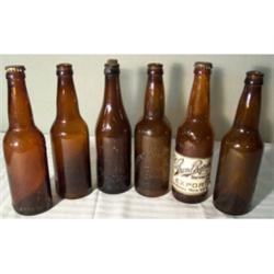 Six 16-oz amber beer bottles, midwest