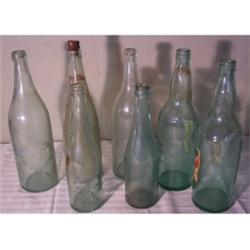 Seven microwbrew beer bottles
