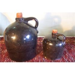 Lot of two brown jugs, 11 1/2" and 8"