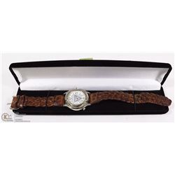 GUESS WATCH. SOME SCRATCHES ON FACE