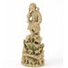 Image 1 : A 19th Century European carved ivory figure of a shepherd, seated above sheep and a reclining wom...
