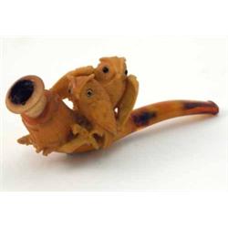 A meerschaum pipe, carved as two owls with glass eyes perched on a branch, in leather case, 4.5 i...