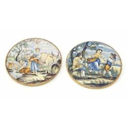A pair of 19th century Italian maiolica circular plaques, decorated with figures dancing and wash...