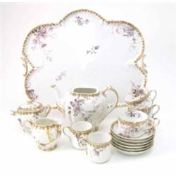 An early 20th century Haviland & Co Limoges cabaret set, with tray (teapot lid missing, milk jug...