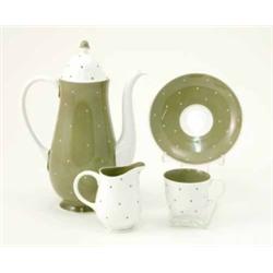 A Susie Cooper 1950’s coffee service, including a coffee pot, cream jug, six cups and saucers wit...