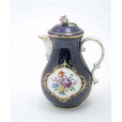 A Meissen coffee pot, baluster shape, decorated with panels of painted flowers and gilt scrolls o...