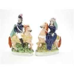 A pair of Staffordshire portrait figures, ‘Louis Napoleon’ and ‘Empress of France’, both seated o...