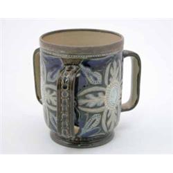 A Doulton Lambeth Frank Butler tyg, with silver mounted rim and beaded foliate decoration centred...