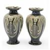 Image 1 : A pair of Doulton Lambeth Frank Butler baluster vases, decorated with stylised scrolling foliage...