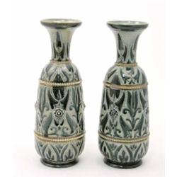 A pair of Royal Doulton vases by F. Butler, incised with stylised foliage within beaded bands, 18...
