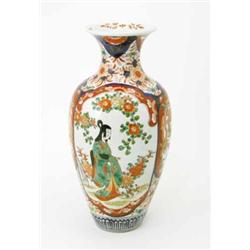 A late Imari baluster vase, with panelled decoration, 17.5ins...