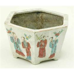 A Chinese porcelain jardiniere, of hexagonal shape painted with figures in famille rose enamels,...
