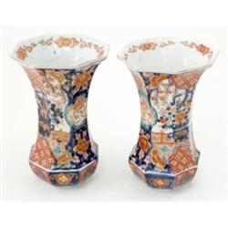 A pair of octagonal Imari trumpet vases, with flowers and phoenix decoration. 8.5ins...