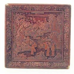 A cinnabar lacquer square dish, decorated in leaf with figures in a landscape. 10ins...