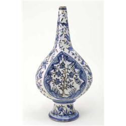 A modern Isnik bottle vase, decorated with flowering trees. 19ins...
