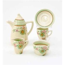 A Clarice Cliff coffee set, consisting of coffee pot, cream jug and sugar bowl and six cups and s...