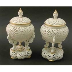 A pair of Grainger’s Worcester reticulated vases and covers, each vase in the form of a jardinier...