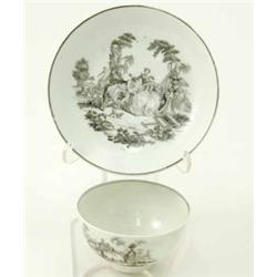 A Worcester tea bowl and saucer, after Robert Hancock, printed in black with figures and garden s...