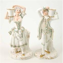 A rare pair of Royal Worcester candlestick figures, gallant and female companion, each modelled h...
