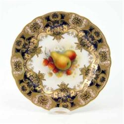 A Royal Worcester plate, painted with a central spray of pears, strawberries and flowers by Alber...