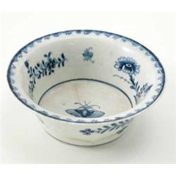 A 18th century Lowestoft Patty pan, painted in underglaze blue with a butterfly and floral sprays...