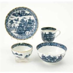 A 18th century Caughley fluted trio and slop bowl, printed with blue and white oriental scenes wi...