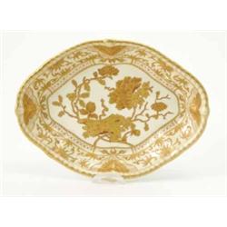 A Royal Crown Derby shaped oval dish, decorated with flowers and panels of scrolling foliage in r...