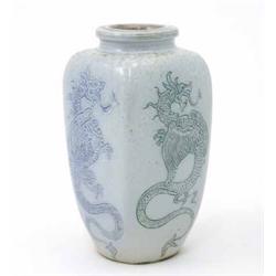 A Martinware squared high shouldered vase, incised with dragons on a pale blue ground, signed and...
