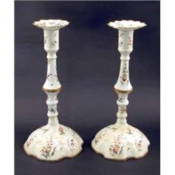 A pair of 18th century Bilston enamel candlesticks, tall knopped stems and domed petal-bases, pai...