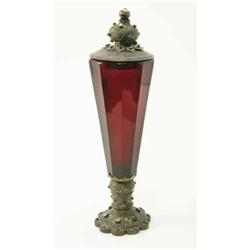 A Continental 19th century ruby glass vase, and cover of faceted tapering shape, on jewelled and...