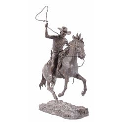 Cowboy on Galloping Horseback Sculpture