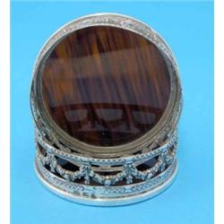 A pair of Continental white metal wine coasters, with foliate pierced sides and simulated tortois...